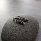 Gunmetal Feather Earrings, blackened silver feather, tiny feather earring, small gun metal feather, little feather dangle, simple feather, silvery black feather earring