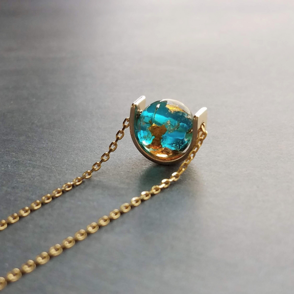 Eclipse Necklace, gold over blue glass ball necklace, gold spinner necklace, goil flake foil, mottled turquoise bead, teal glass bead, Earth
