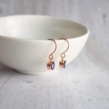 Evil Eye Earrings - small rose gold/navy blue dangle - protect from negative energy harm - good fortune luck symbol - health & happiness - Constant Baubling