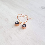 Evil Eye Earrings - small rose gold/navy blue dangle - protect from negative energy harm - good fortune luck symbol - health & happiness - Constant Baubling