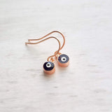 Evil Eye Earrings - small rose gold/navy blue dangle - protect from negative energy harm - good fortune luck symbol - health & happiness - Constant Baubling