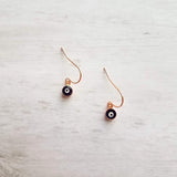 Evil Eye Earrings - small rose gold/navy blue dangle - protect from negative energy harm - good fortune luck symbol - health & happiness - Constant Baubling