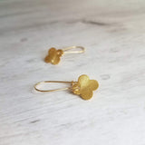 Gold Clover Earrings - small brushed 4 lobe leaf good luck charm dangle on simple latching kidney ear hook - St Patricks Day gift - Constant Baubling
