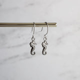 Tiny Seahorse Earrings - little antique silver silver charms dangle on small simple shiny delicate hooks, tropical beach vacation memento - Constant Baubling