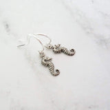 Tiny Seahorse Earrings - little antique silver silver charms dangle on small simple shiny delicate hooks, tropical beach vacation memento - Constant Baubling