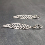 Thin Silver Leaf Earrings, long narrow leaf earrings, filigree leaves earring, long silver leaf earring, cut out leaf earring, huggie hoops - Constant Baubling
