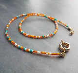 Seed Bead Necklace with oversized front sailor clasp, gold front clasp, orange and blue seed beads, orange and turquoise necklace, tiny bead strand, little bead necklace, tiny bead necklace, seed bead strand, chunky gold clasp