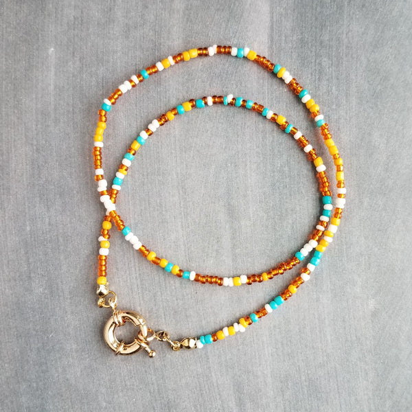 Seed Bead Necklace with oversized front sailor clasp, gold front clasp, orange and blue seed beads, orange and turquoise necklace, tiny bead strand, little bead necklace, tiny bead necklace, seed bead strand, chunky gold clasp