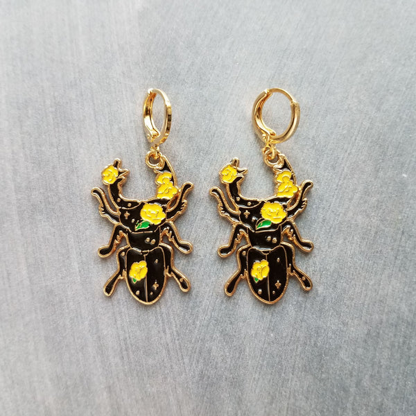 Black Beetle Earrings, stag horn beetle, beetle jewelry, gold huggie hoop, yellow flowers on beetle, insect jewelry, black enamel bug