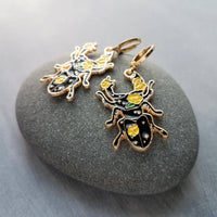 Black Beetle Earrings, stag horn beetle, beetle jewelry, gold huggie hoop, yellow flowers on beetle, insect jewelry, black enamel bug