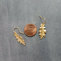 Little Gold Oak Leaf Earrings - raw brass leaves dangle on gold plated simple hooks or upgraded 14K SOLID GOLD hooks, tiny brass detailed leaf charm, autumn dangle, minimalist fall jewelry gift for her, acorn oak tree jewelry