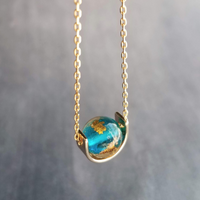 Eclipse Necklace, gold over blue glass ball necklace, gold spinner necklace, goil flake foil, mottled turquoise bead, teal glass bead, Earth