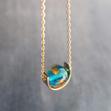 Eclipse Necklace, gold over blue glass ball necklace, gold spinner necklace, goil flake foil, mottled turquoise bead, teal glass bead, Earth