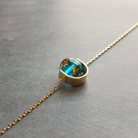 Eclipse Necklace, gold over blue glass ball necklace, gold spinner necklace, goil flake foil, mottled turquoise bead, teal glass bead, Earth