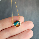 Eclipse Necklace, gold over blue glass ball necklace, gold spinner necklace, goil flake foil, mottled turquoise bead, teal glass bead, Earth