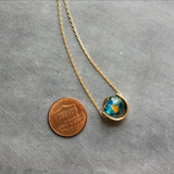 Eclipse Necklace, gold over blue glass ball necklace, gold spinner necklace, goil flake foil, mottled turquoise bead, teal glass bead, Earth