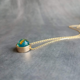 Eclipse Necklace, gold over blue glass ball necklace, gold spinner necklace, goil flake foil, mottled turquoise bead, teal glass bead, Earth