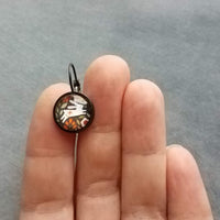 Bunny Earrings, leaping rabbit earring, Easter jewelry, round print under glass on black lever back hooks, snap close leverback, runaway