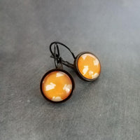 Bunny Earrings, leaping rabbit earring, Easter jewelry, round print under glass on black lever back hooks, snap close leverback, runaway