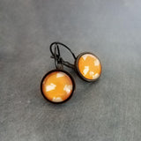 Bunny Earrings, leaping rabbit earring, Easter jewelry, round print under glass on black lever back hooks, snap close leverback, runaway