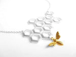 Honeycomb Necklace - gold brass bumblebee dangles from large bee hive pendant in matte silver on simple silver plated chain - Constant Baubling