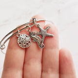 Beach Charm Bracelet - silver adjustable bangle double loop wire w/ seahorse, starfish, silver dollar dangles - vacation sea theme gift - Constant Baubling