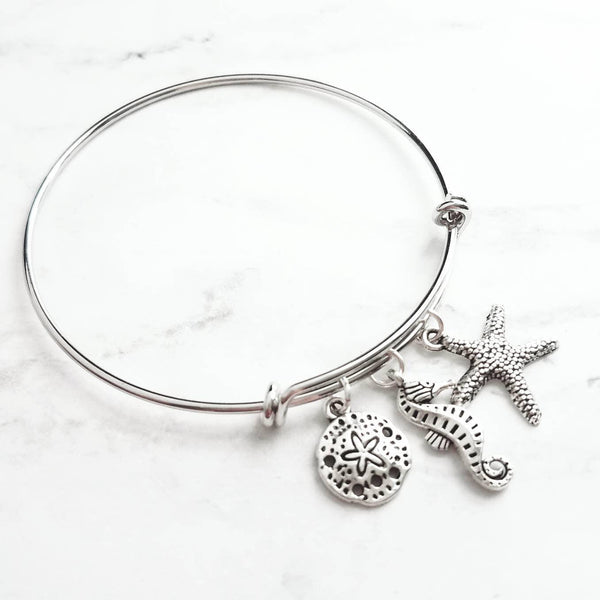 Beach Charm Bracelet - silver adjustable bangle double loop wire w/ seahorse, starfish, silver dollar dangles - vacation sea theme gift - Constant Baubling