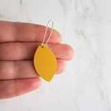 Yellow Earrings - goldenrod/mustard faux vegan leather leaf shape drop on silver kidney wire hooks - plain pointed oval spheroid charm - Constant Baubling