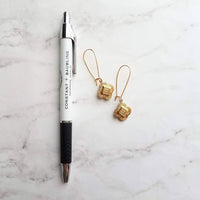 Gold Clover Earring - sweet little stamped 4 leaf/lobe Irish good luck charm on long latching kidney hook - raised design w/ ornate detail - Constant Baubling