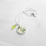 Flower Necklace, yellow flower pendant, floral necklace, plant necklace, light green leaf charm, delicate silver chain, little flowers round - Constant Baubling