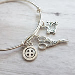 Sewing Charm Bracelet - seamstress hobby/tailor gift - silver adjustable bangle double loop wire w/ tiny sewing machine, scissors, button - Constant Baubling