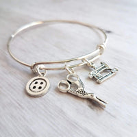 Sewing Charm Bracelet - seamstress hobby/tailor gift - silver adjustable bangle double loop wire w/ tiny sewing machine, scissors, button - Constant Baubling
