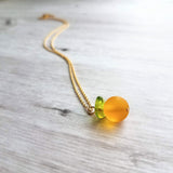 Orange Necklace, small fruit pendant, green leaf charm, orange jewelry, glass orange, translucent orange, Florida fruit, simple gold chain - Constant Baubling