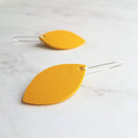 Yellow Earrings - goldenrod/mustard faux vegan leather leaf shape drop on silver kidney wire hooks - plain pointed oval spheroid charm - Constant Baubling