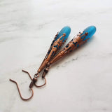 Long Copper Sea Glass Earrings - frosted elongated narrow teal blue teardrop in ornate lacy filigree oxidized antiqued thin cone wrap 3 inch - Constant Baubling