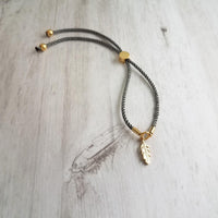 Gold Feather Bracelet, grey cord bracelet, gray gold bracelet, thin bracelet, stacking bracelet, twisted bracelet, minimalist, simple charm - Constant Baubling