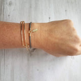 Gold Feather Bracelet, grey cord bracelet, gray gold bracelet, thin bracelet, stacking bracelet, twisted bracelet, minimalist, simple charm - Constant Baubling