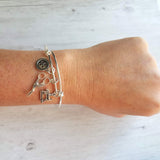 Sewing Charm Bracelet - seamstress hobby/tailor gift - silver adjustable bangle double loop wire w/ tiny sewing machine, scissors, button - Constant Baubling