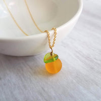 Orange Necklace, small fruit pendant, green leaf charm, orange jewelry, glass orange, translucent orange, Florida fruit, simple gold chain - Constant Baubling