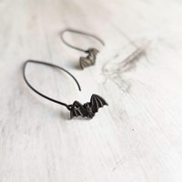 Black Bat Earrings, tiny bat earring, bat dangle, little flying bats, long matte black hook, 2 inch earring, Halloween jewelry, trick treat - Constant Baubling