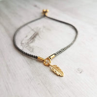 Gold Feather Bracelet, grey cord bracelet, gray gold bracelet, thin bracelet, stacking bracelet, twisted bracelet, minimalist, simple charm - Constant Baubling