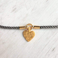 Rope Bracelet, matte gold heart charm, grey twisted cord, thin string, gold medallion, adjustable gray cord silky stacking layering bracelet - Constant Baubling