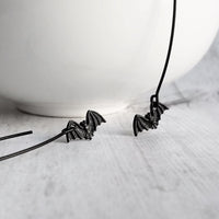 Black Bat Earrings, tiny bat earring, bat dangle, little flying bats, long matte black hook, 2 inch earring, Halloween jewelry, trick treat - Constant Baubling