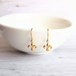 Fleur De Lis Earrings - little tiny gold lily flower charm dangles - small simple ear hooks - French emblem - New Orleans gift for her - Constant Baubling