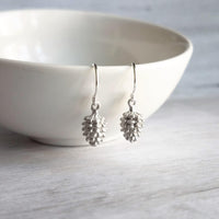 Silver Pine Cone Earrings - small matte silver plated mini pinecone charms on tiny silver plated hooks - minimalist and simple - Constant Baubling