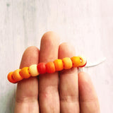 Orange Bead Bracelet, large bead bracelet, orange bracelet, tie on cord, cord bracelet, orange rollers, burnt orange ombre beads, big chunky - Constant Baubling
