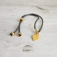 Rope Bracelet, matte gold heart charm, grey twisted cord, thin string, gold medallion, adjustable gray cord silky stacking layering bracelet - Constant Baubling
