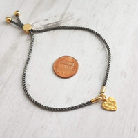 Rope Bracelet, matte gold heart charm, grey twisted cord, thin string, gold medallion, adjustable gray cord silky stacking layering bracelet - Constant Baubling