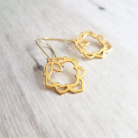 Lotus Earrings - gold ornate flower outline charms dangle on simple latching kidney ear hook - goddess rebirth triumph purity symbolic gift - Constant Baubling