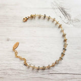 Labradorite Bracelet, tiny grey stone, semi precious gemstone, adjustable gold chain, vitreous iridescent blue green flash, spiritual symbol - Constant Baubling